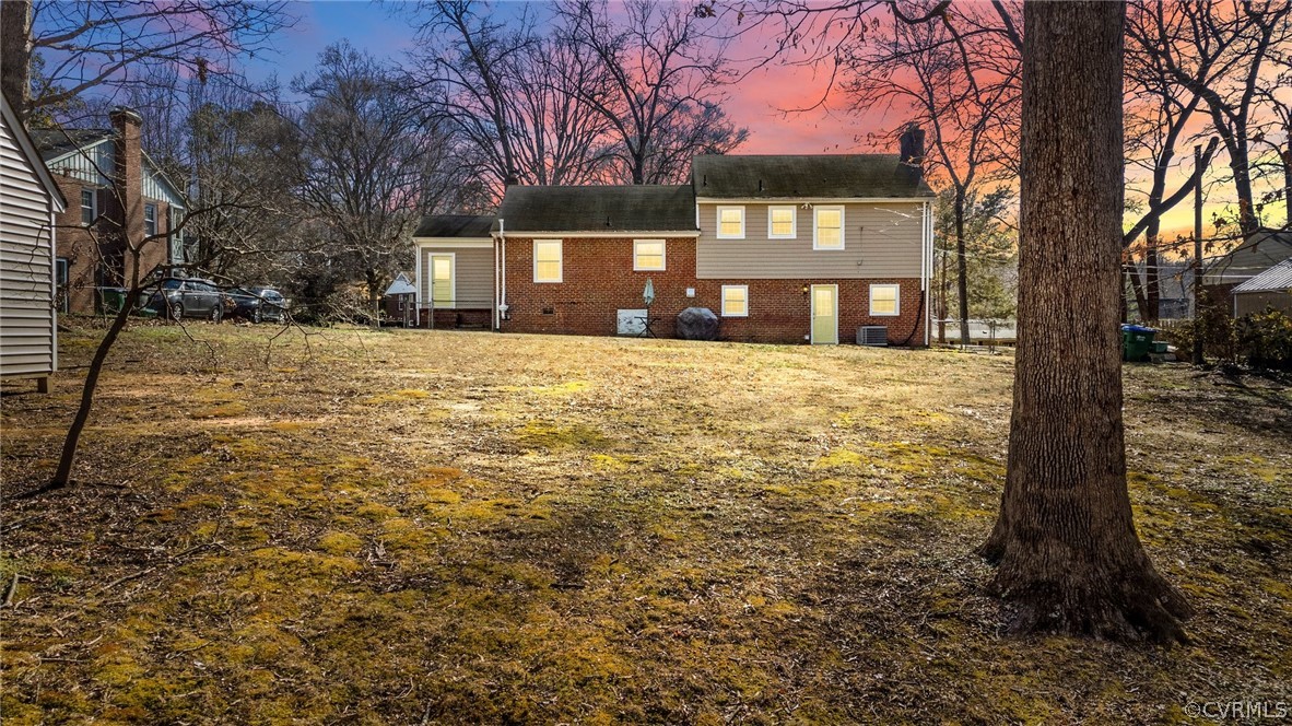 8822 Chippenham Road Richmond, VA 23235 - Photo 33 of 37 a front view of a house with a yard and garage