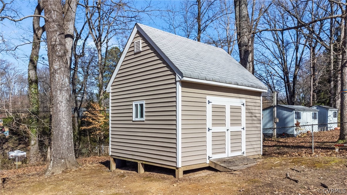 8822 Chippenham Road Richmond, VA 23235 - Photo 34 of 37 a view of a house with a yard and garage