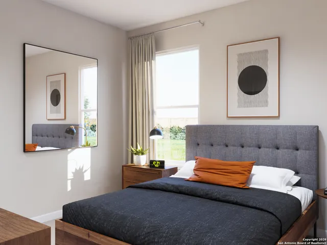 a bedroom with a bed and window