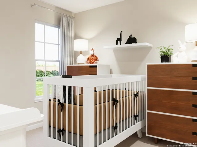 a bedroom with furniture and a window