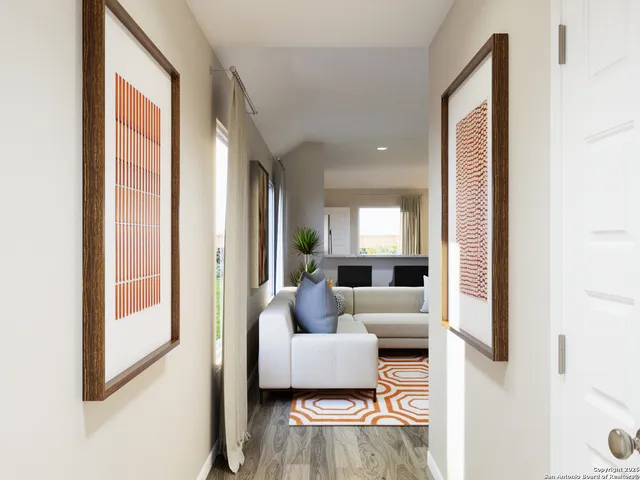 a living room with furniture and a large window