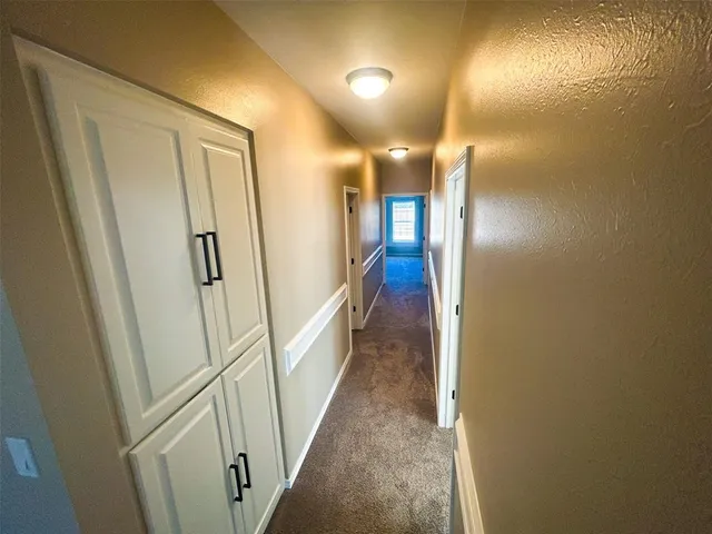 a bathroom with a granite countertop sink toilet a mirror and vanity