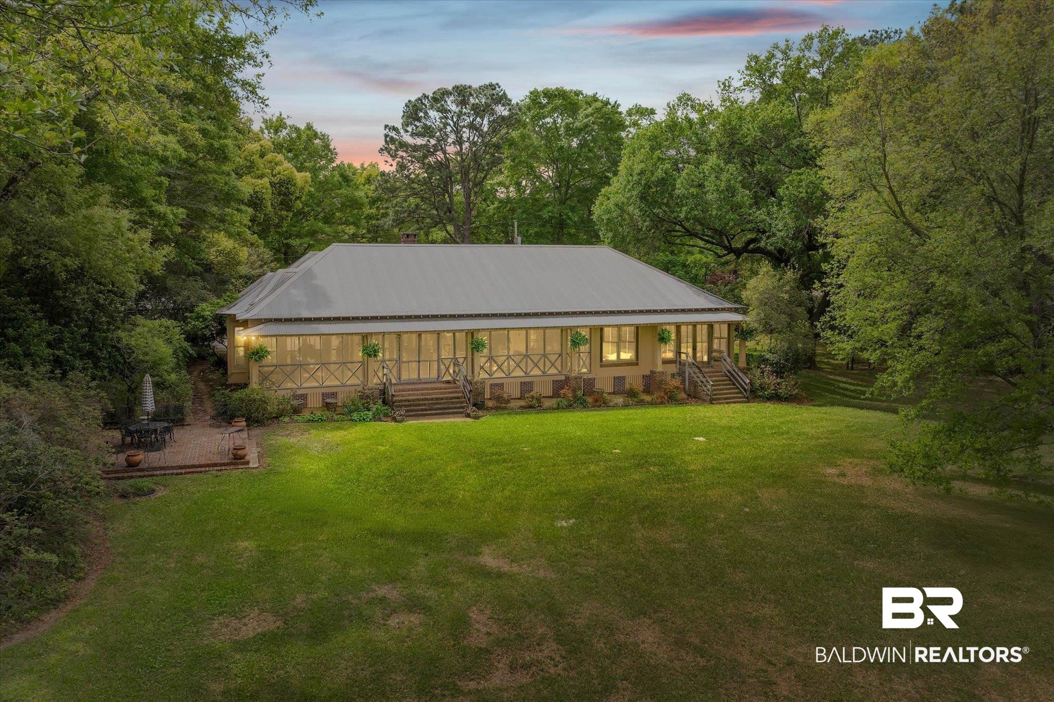 2300 Burgett Road Mobile, AL 36605 - Photo 35 of 40 Back of house featuring covered porch, crawl space, a metal roof, and a yard