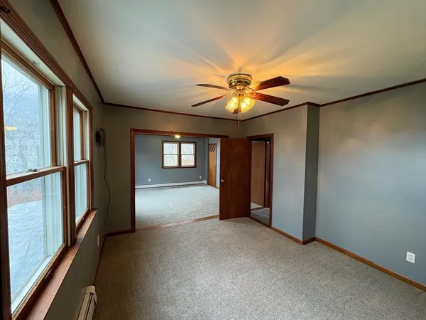 a view of an empty room with glass door