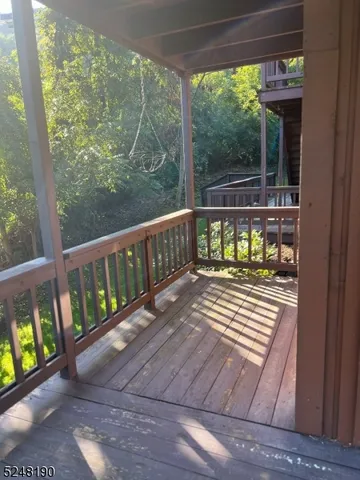 a view of a two chairs in the balcony