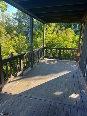 a view of swimming pool with seating space