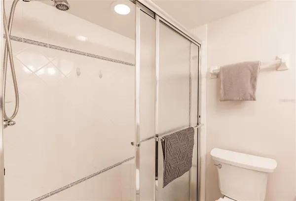 a bathroom with a shower and a toilet