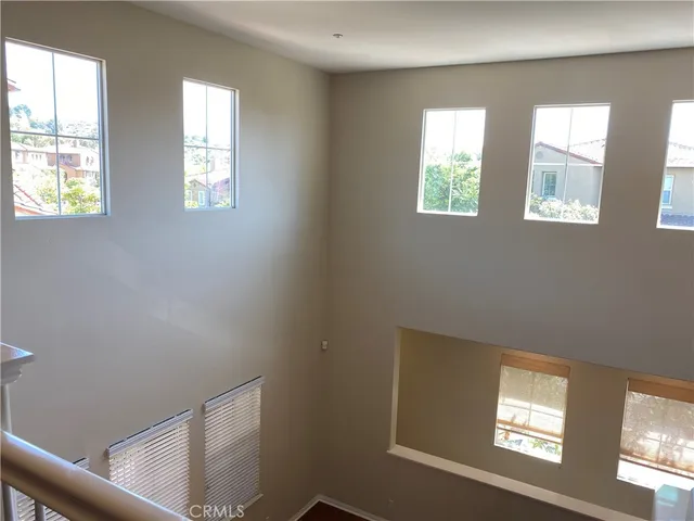 a view of an empty room with windows