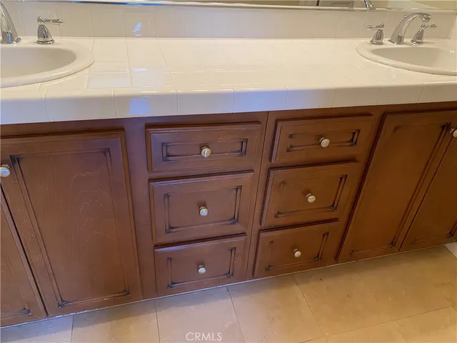 a view of a sink and cabinets