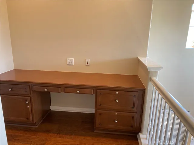 a view of cabinets and wooden floor