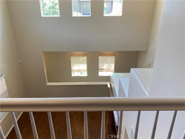 a view of wooden floor and windows