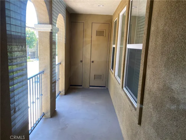 a view of a hallway with windows