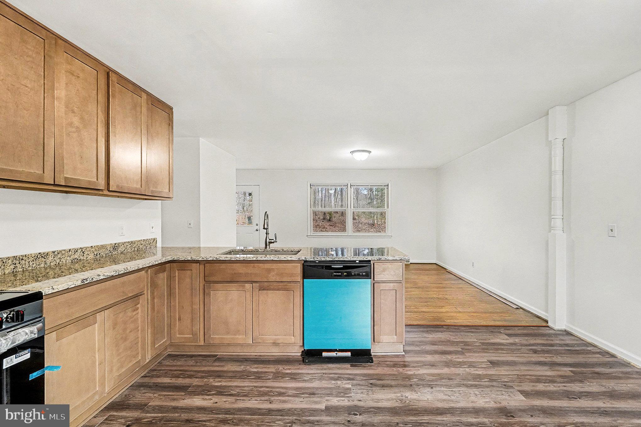 4127 Cabin Road Reva, VA 22735 - Photo 13 of 28 a kitchen with granite countertop a sink and cabinets