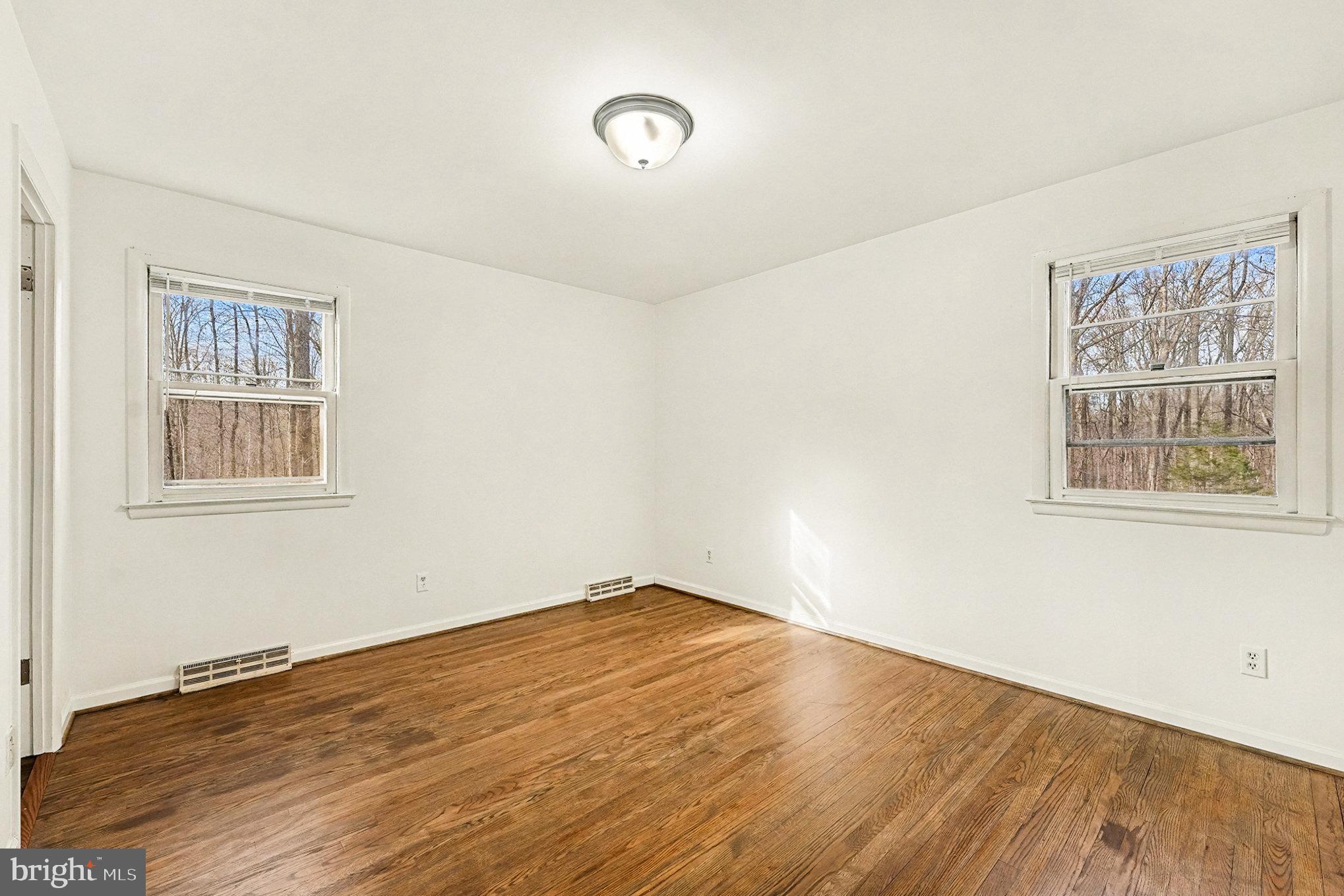 4127 Cabin Road Reva, VA 22735 - Photo 14 of 28 a view of empty room with wooden floor and fan
