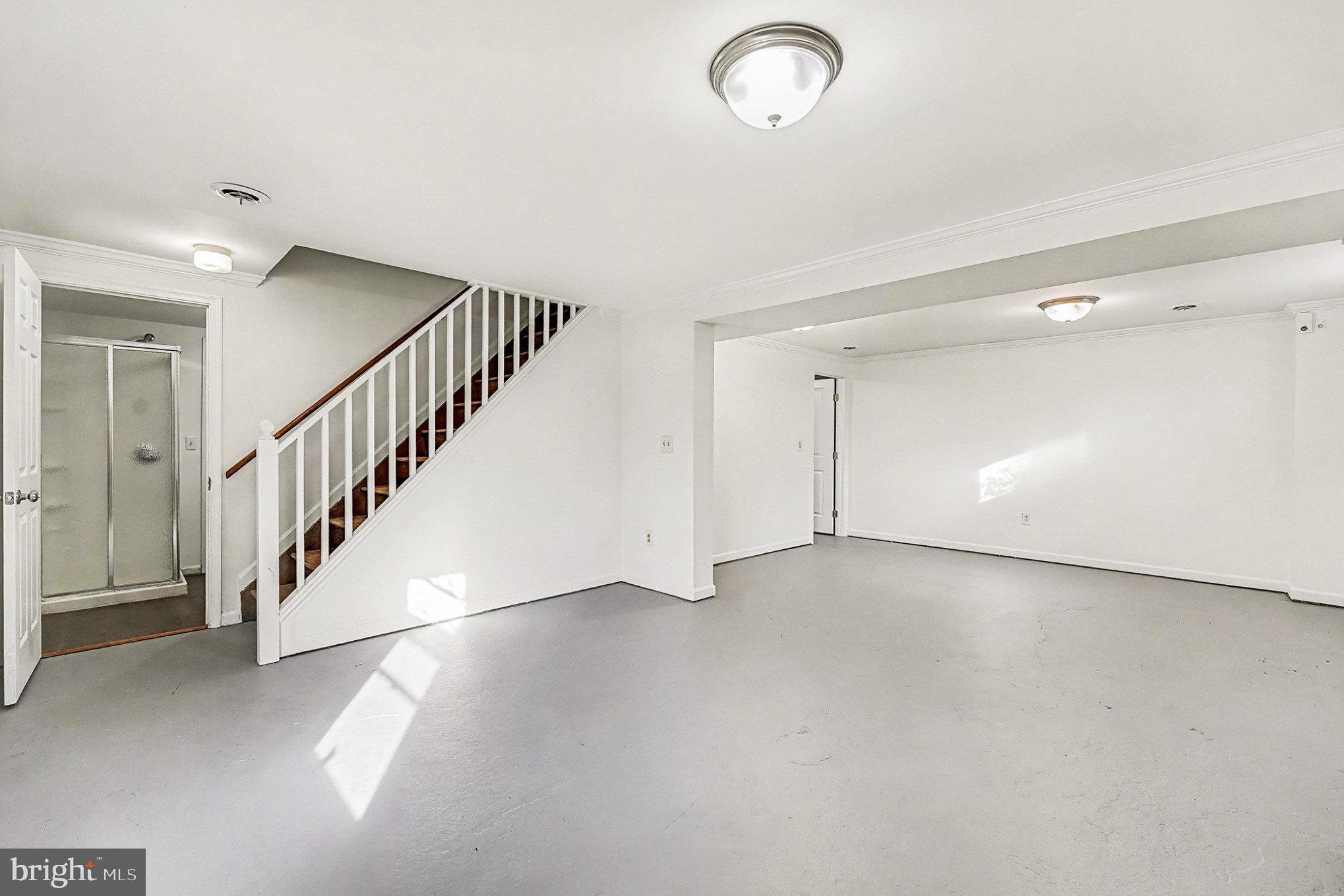 4127 Cabin Road Reva, VA 22735 - Photo 20 of 28 a view of an empty room with wooden floor and stairs