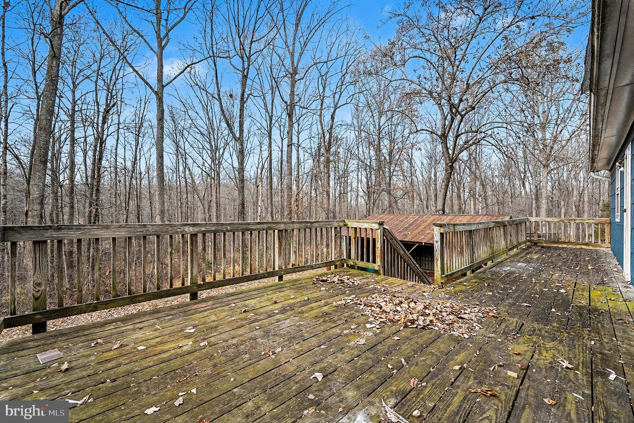 4127 Cabin Road Reva, VA 22735 - Photo 24 of 28 a view of a house with wooden deck and trees