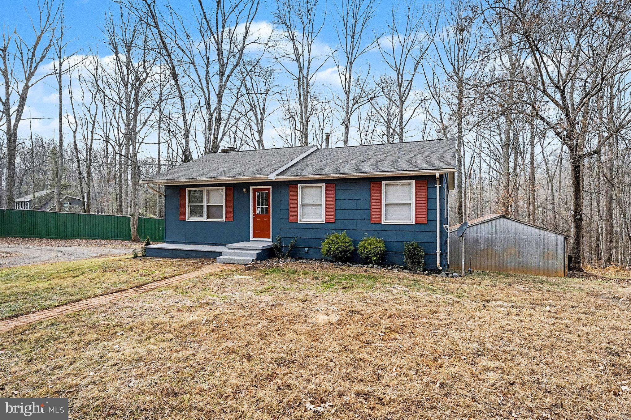 4127 Cabin Road Reva, VA 22735 - Photo 25 of 28 a front view of a house with a garden