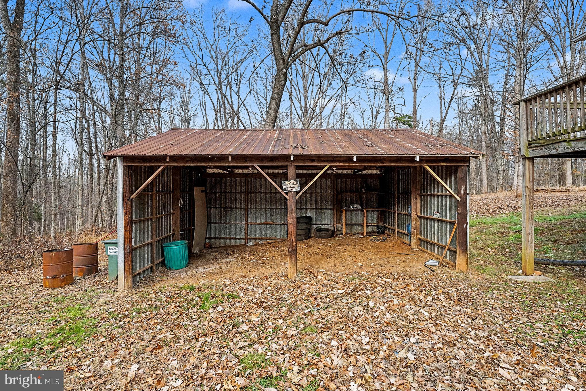 4127 Cabin Road Reva, VA 22735 - Photo 6 of 28 a backyard of a house with barbeque oven table and chairs
