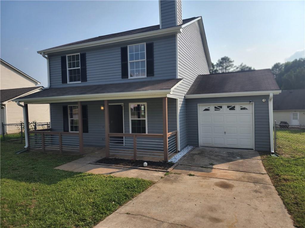 170 Inverness Trace Riverdale, GA 30274 - Photo 1 of 1 a front view of a house with a yard