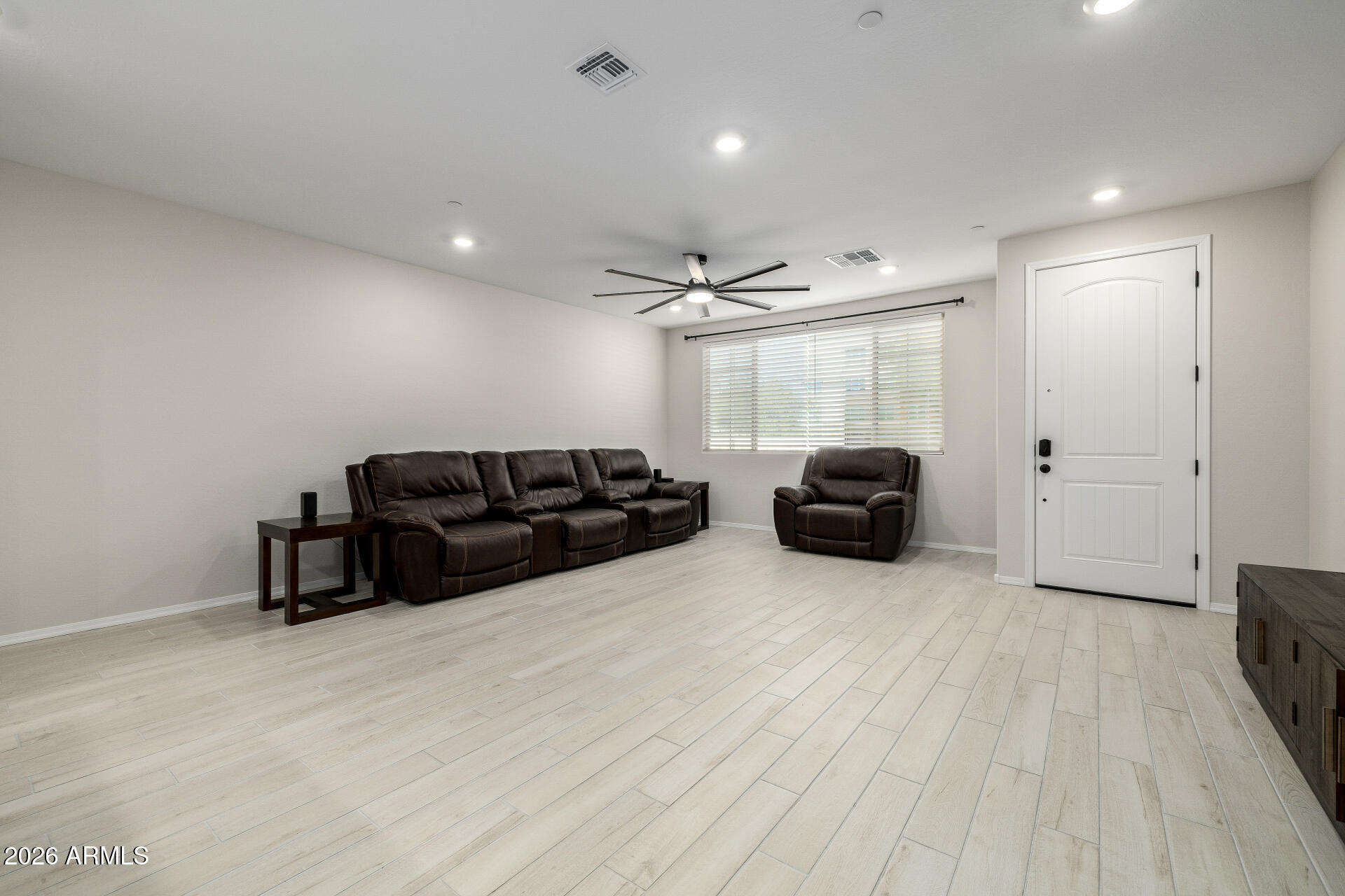 1850 East Bernie Lane, Unit 102 Gilbert, AZ 85295 - Photo 11 of 62 a living room with furniture and a wooden floor