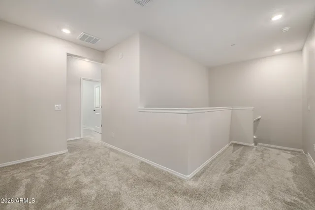 a bedroom with a bed lamp closet and window