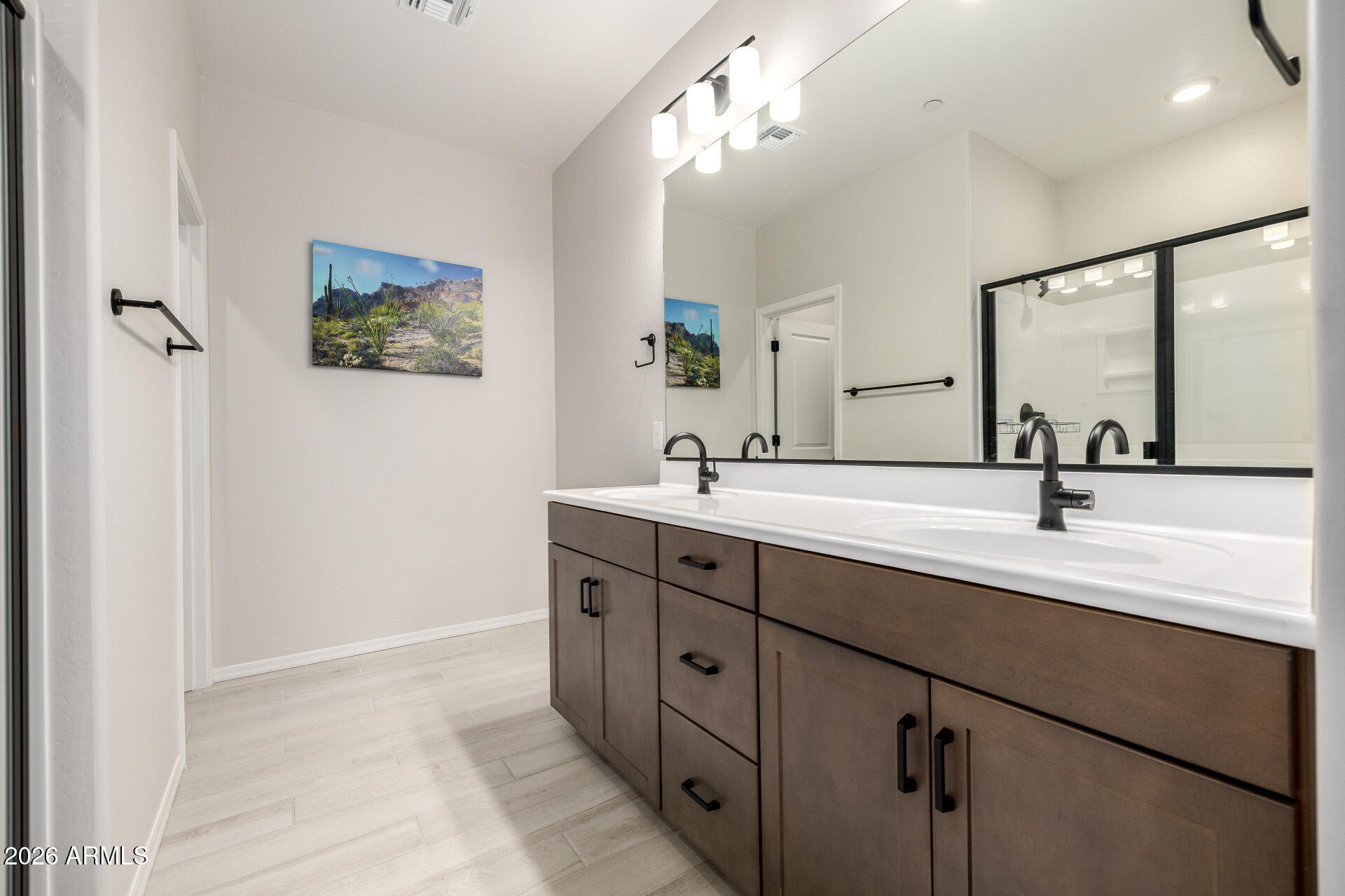 1850 East Bernie Lane, Unit 102 Gilbert, AZ 85295 - Photo 18 of 62 a bathroom with a double vanity sink a mirror and shower