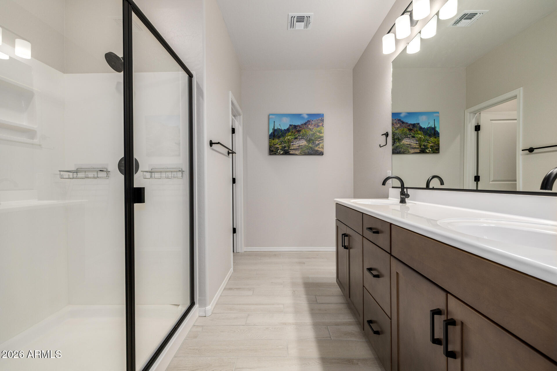 1850 East Bernie Lane, Unit 102 Gilbert, AZ 85295 - Photo 19 of 62 a bathroom with a double vanity sink a mirror and a shower