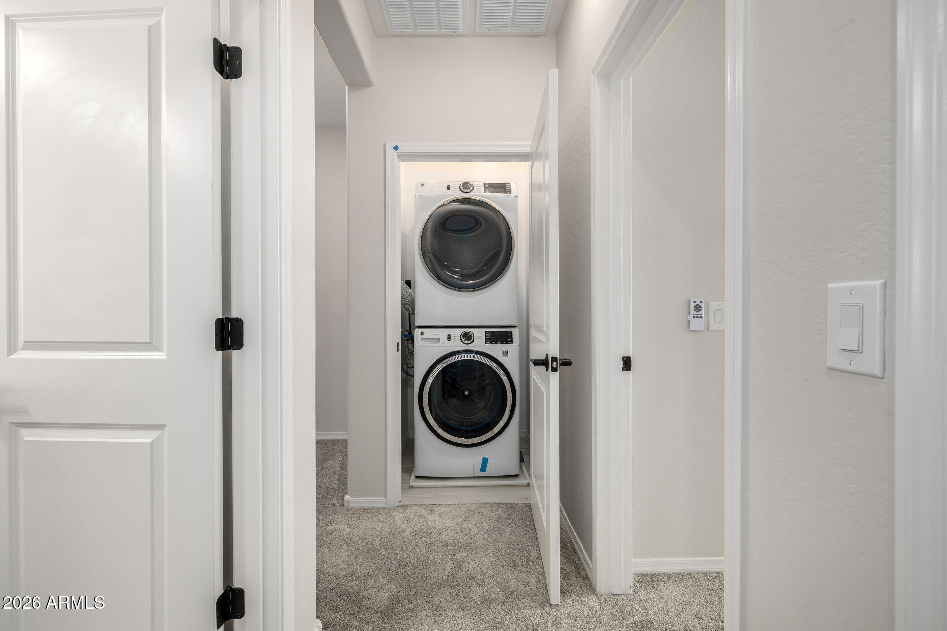 1850 East Bernie Lane, Unit 102 Gilbert, AZ 85295 - Photo 24 of 62 a view of a hallway with washer and dryer