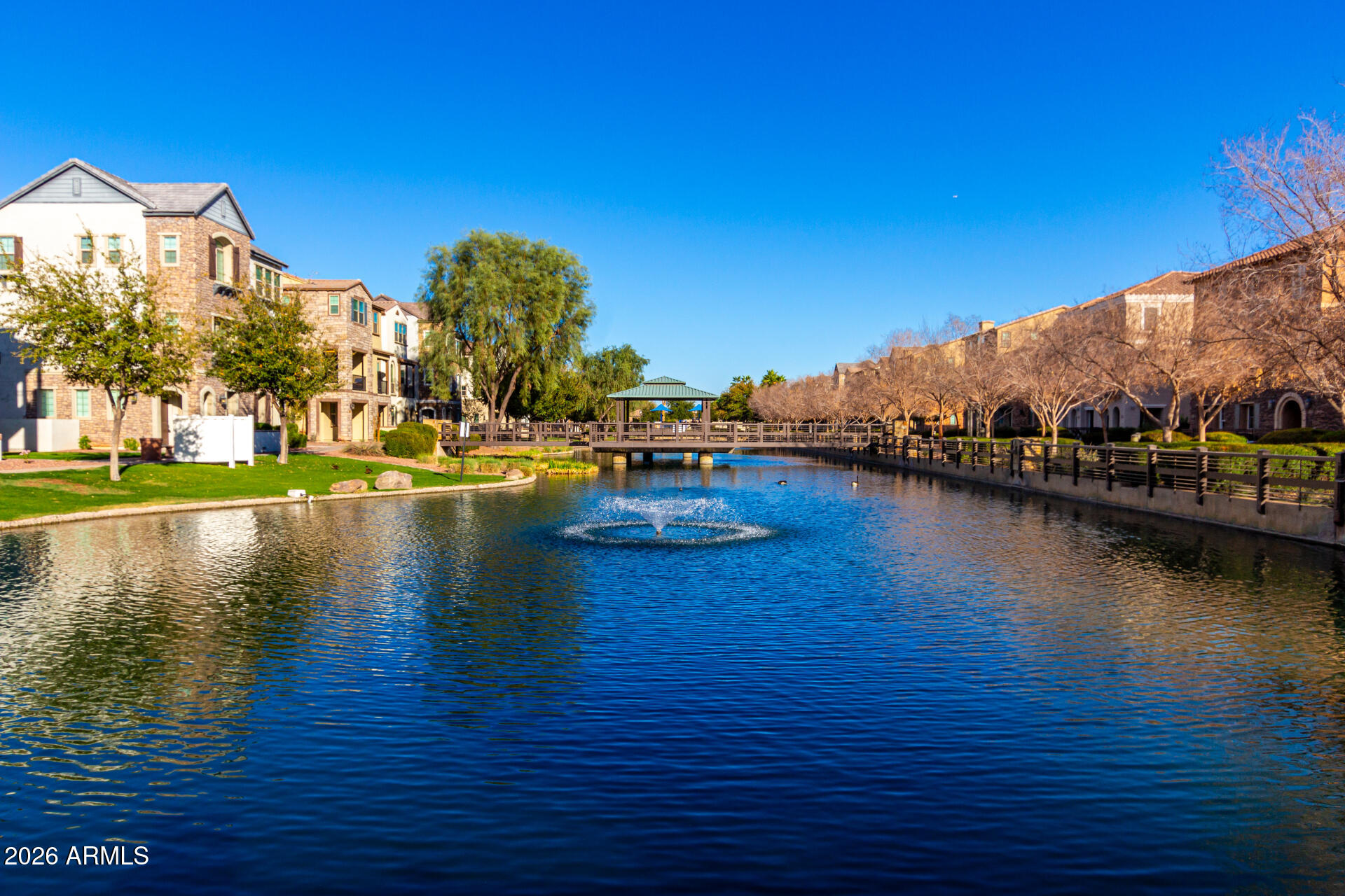 1850 East Bernie Lane, Unit 102 Gilbert, AZ 85295 - Photo 38 of 62 a view of a lake with houses