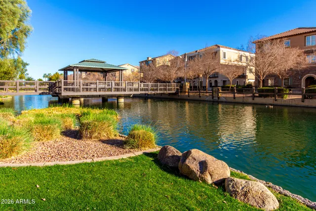 a lake view with a wooden bridge