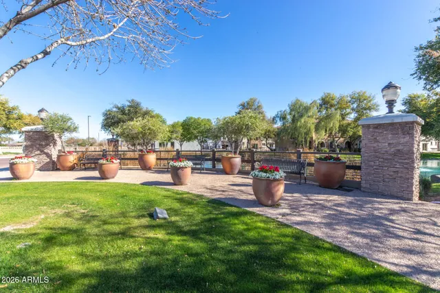 a view of a patio with table and chairs and a fire pit