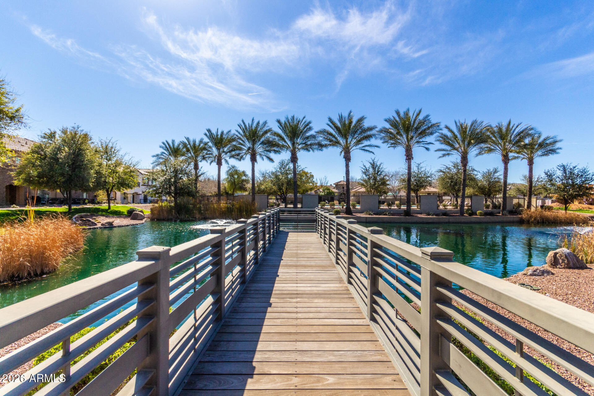 1850 East Bernie Lane, Unit 102 Gilbert, AZ 85295 - Photo 43 of 62 a lake view with a wooden bridge