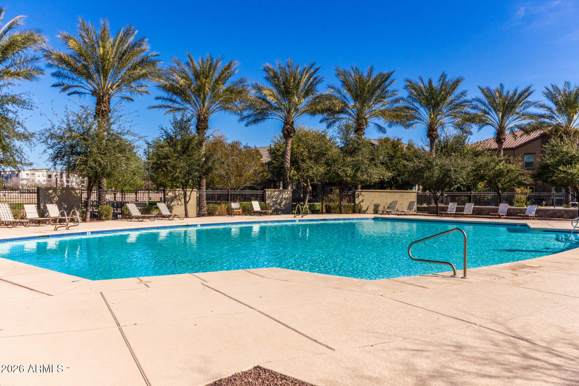 1850 East Bernie Lane, Unit 102 Gilbert, AZ 85295 - Photo 50 of 62 a view of swimming pool with a table and chairs