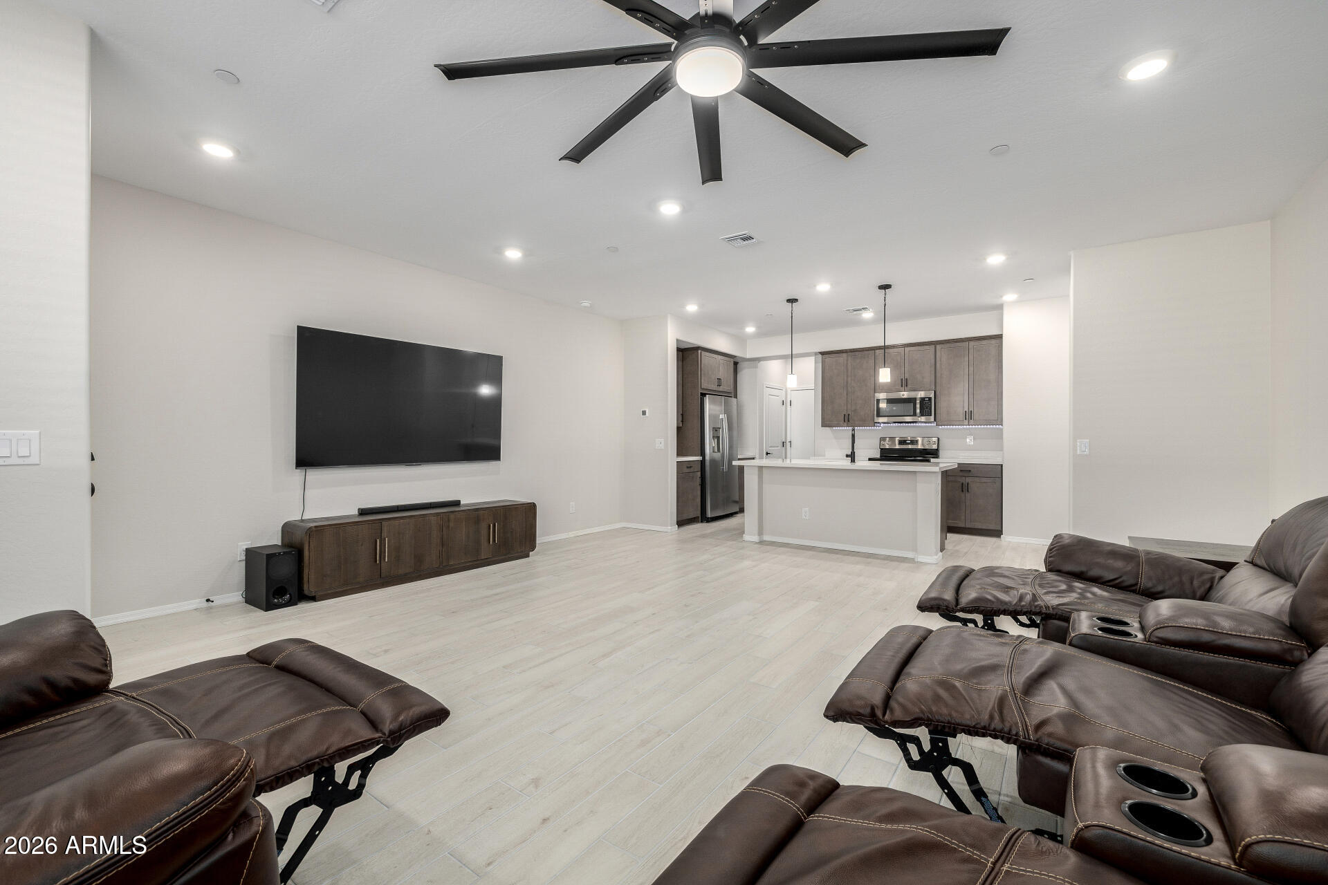 1850 East Bernie Lane, Unit 102 Gilbert, AZ 85295 - Photo 5 of 62 a living room with furniture and a flat screen tv