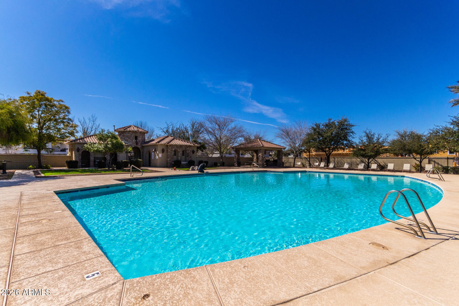 1850 East Bernie Lane, Unit 102 Gilbert, AZ 85295 - Photo 51 of 62 a view of a swimming pool and lounge chairs