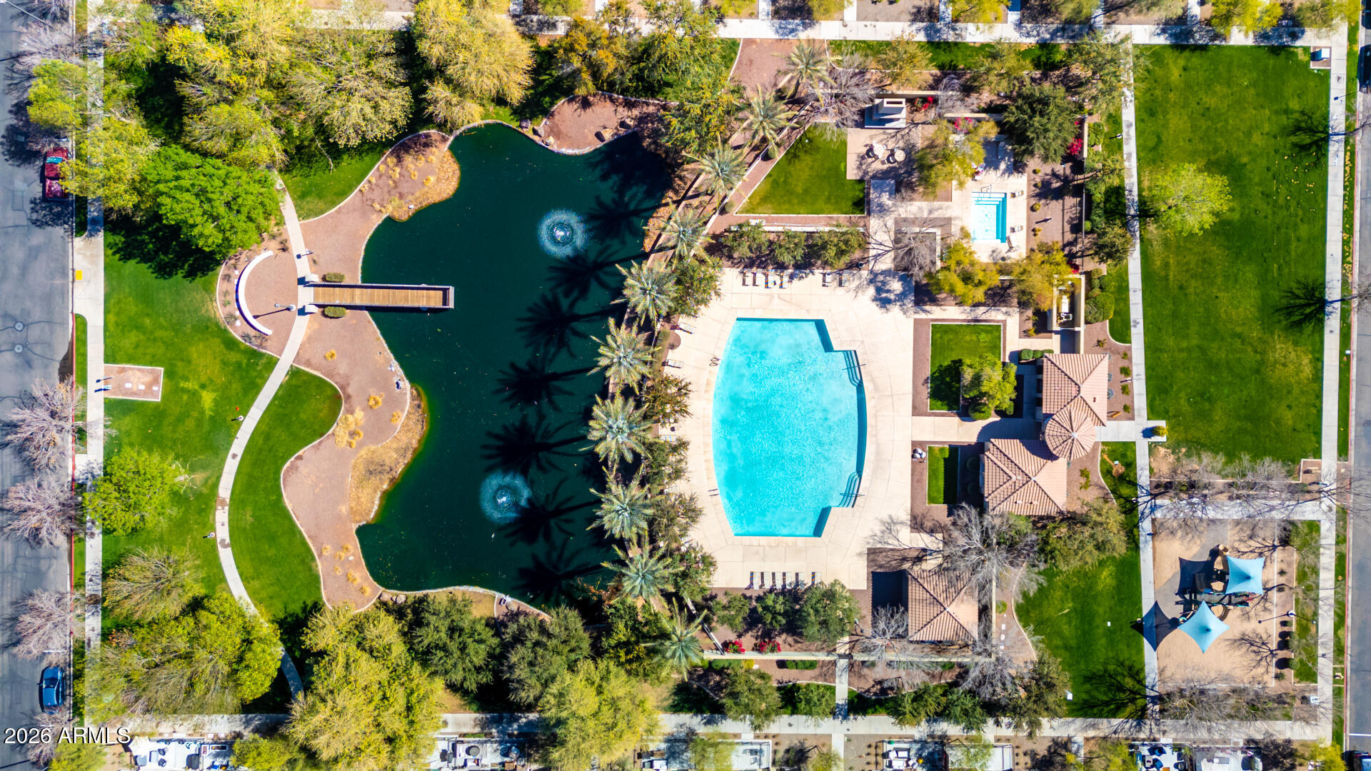 1850 East Bernie Lane, Unit 102 Gilbert, AZ 85295 - Photo 54 of 62 an aerial view of residential houses with outdoor space and street view