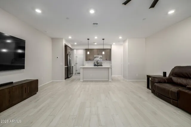 a view of kitchen with furniture and wooden floor