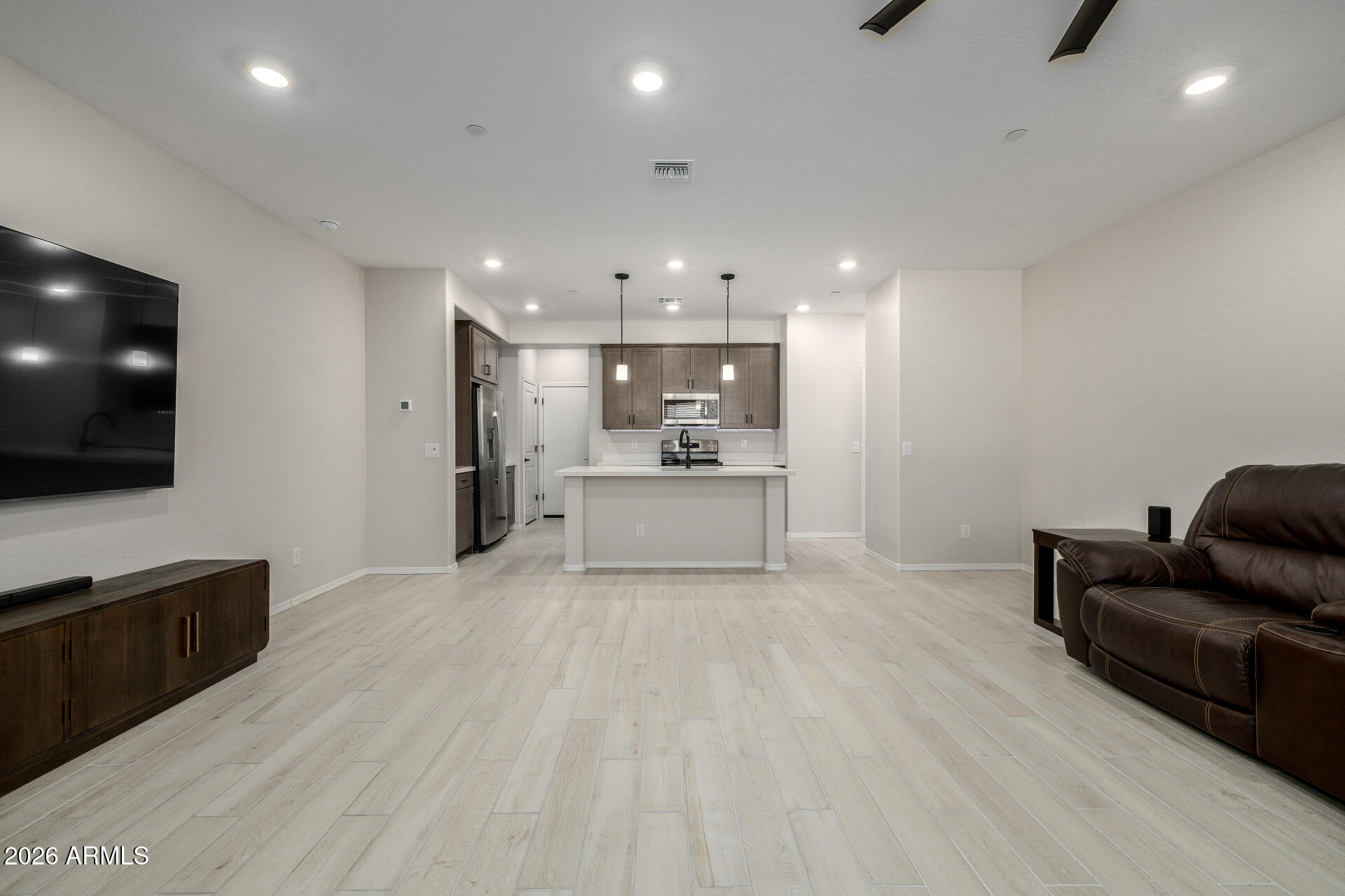 1850 East Bernie Lane, Unit 102 Gilbert, AZ 85295 - Photo 6 of 62 a view of kitchen with furniture and wooden floor