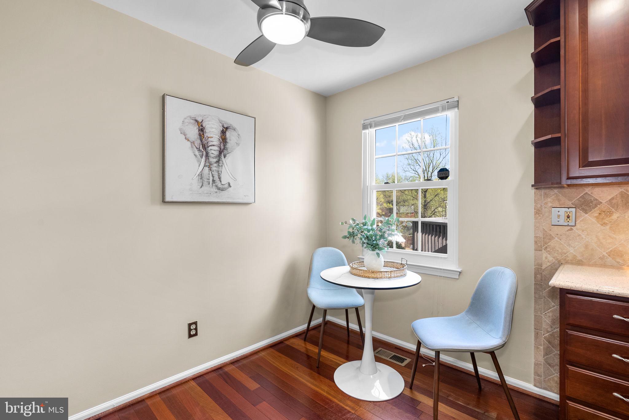 122 Hamilton Avenue Silver Spring, MD 20901 - Photo 17 of 45 a view of a dining room with furniture a chandelier and wooden floor