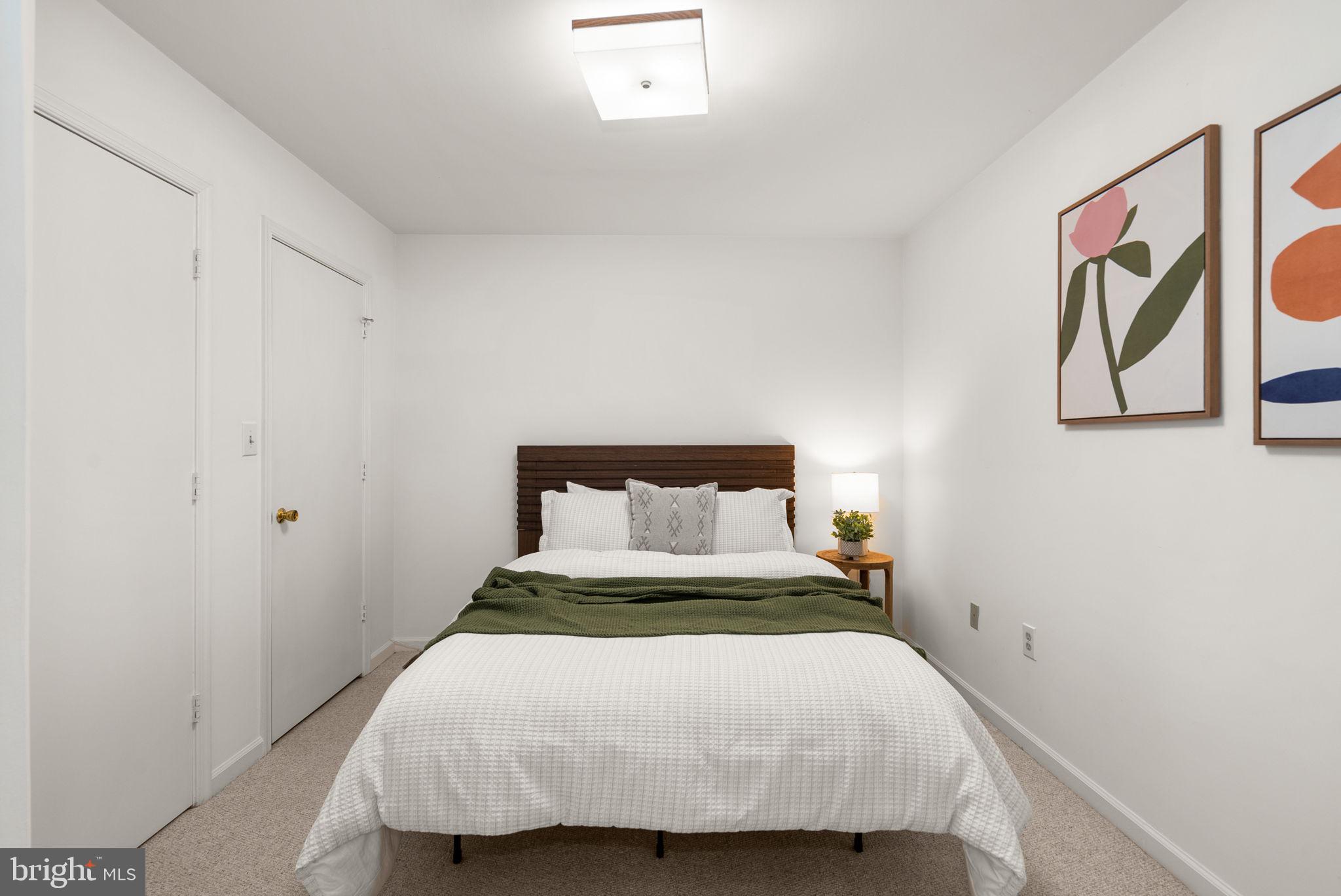 122 Hamilton Avenue Silver Spring, MD 20901 - Photo 33 of 45 a bedroom with a bed and painting on the wall