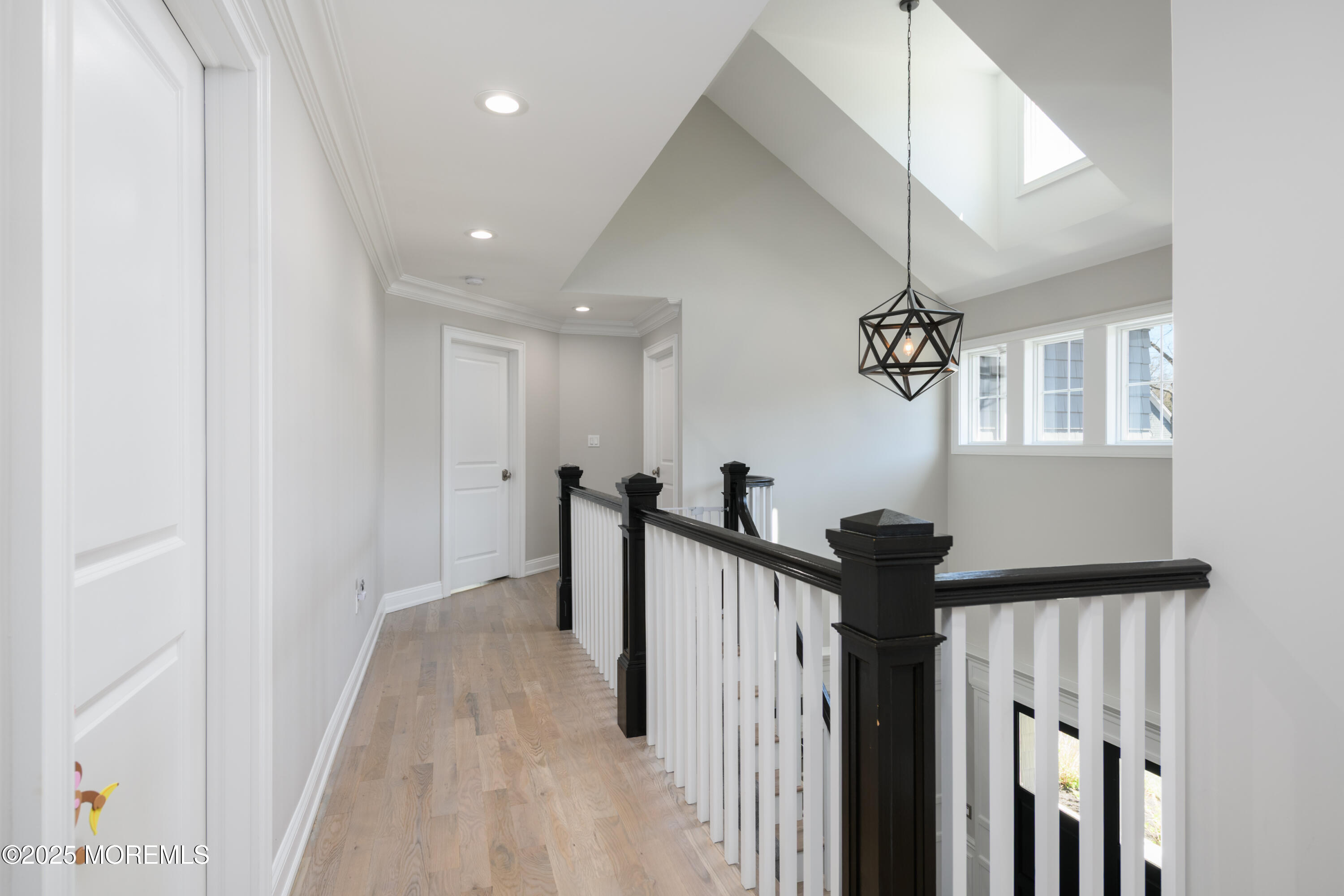 98 Harvard Road Fair Haven, NJ 07704 - Photo 20 of 51 a view of a hallway with a chandelier