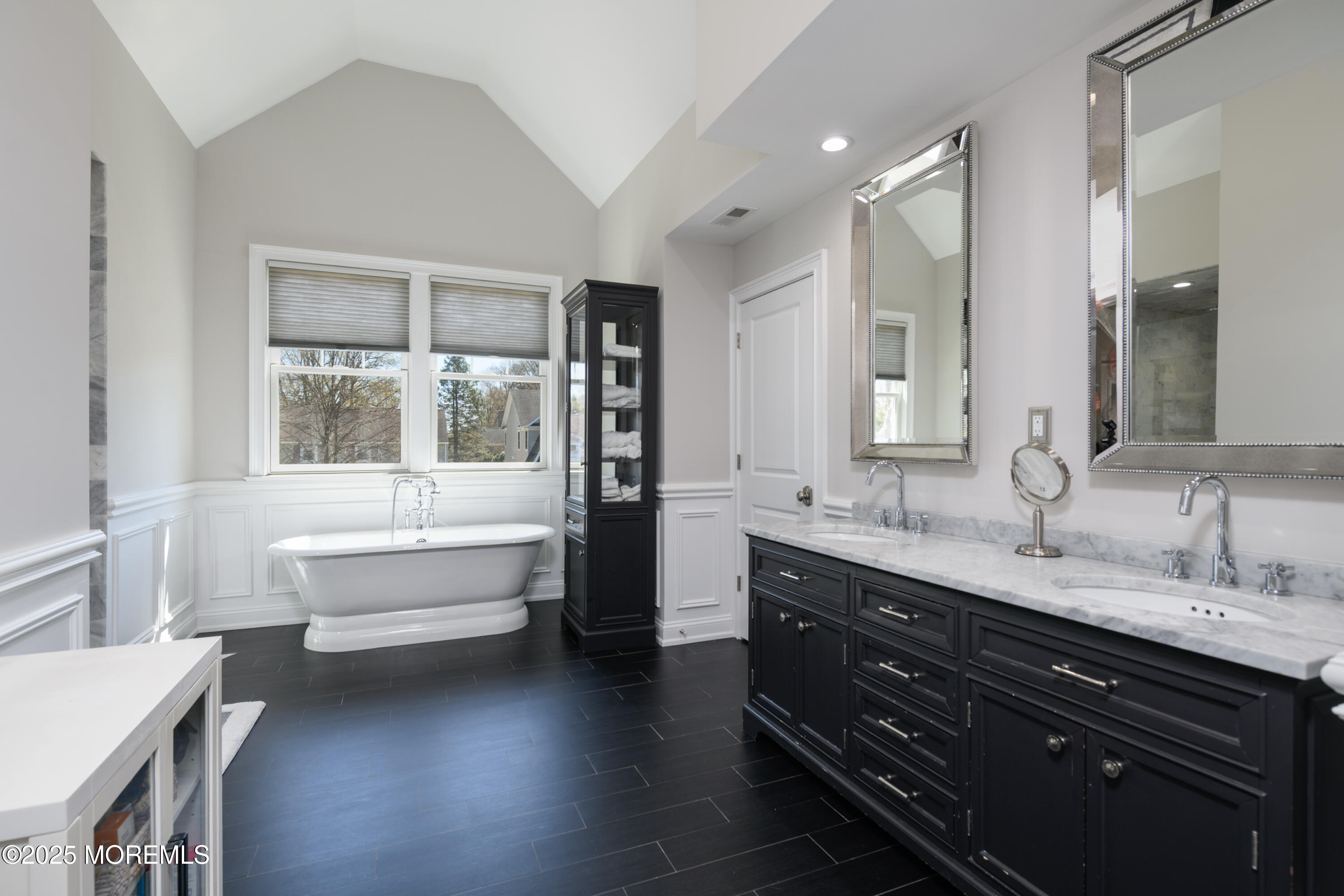 98 Harvard Road Fair Haven, NJ 07704 - Photo 21 of 51 a bathroom with a double vanity sink a large mirror and bathtub