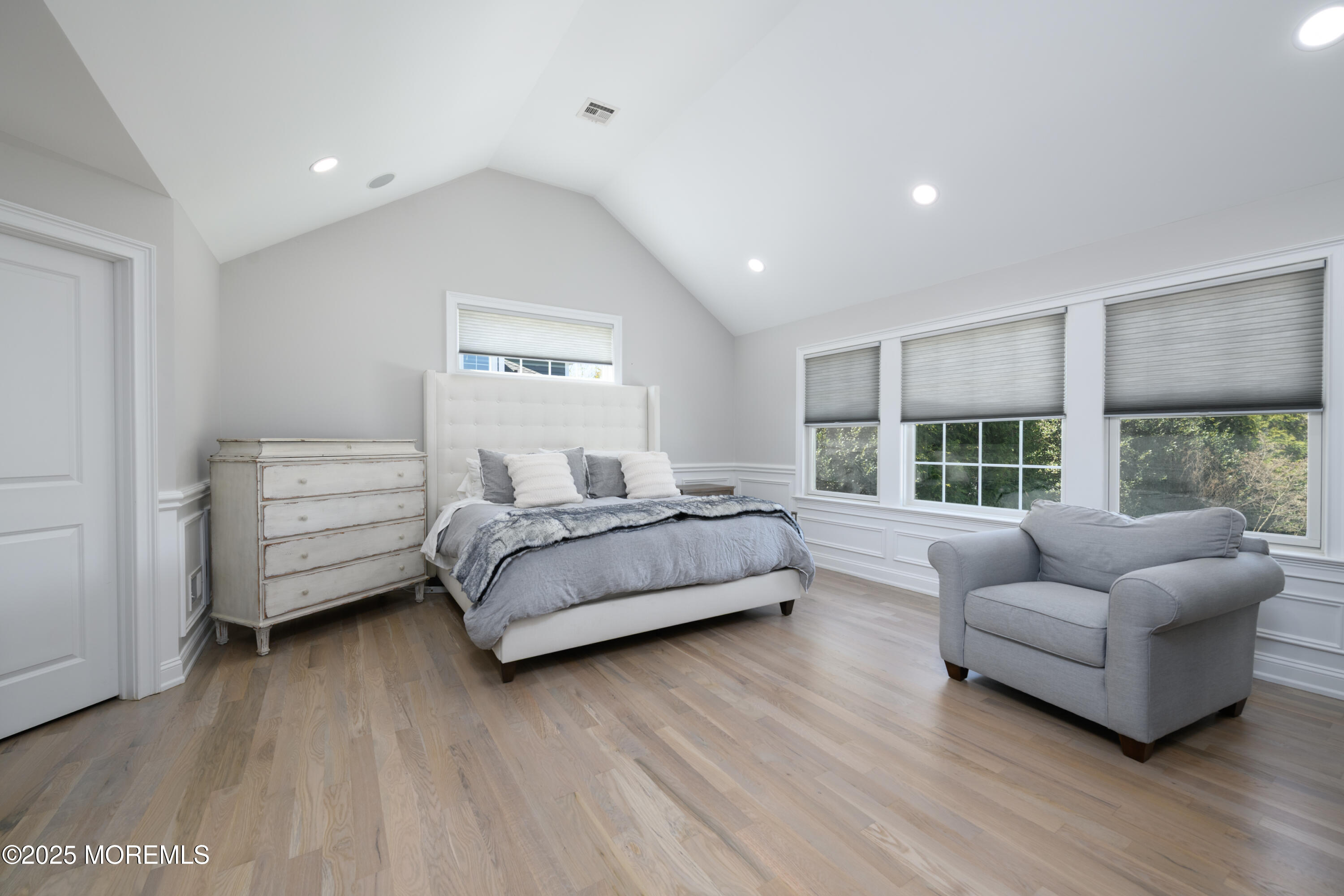 98 Harvard Road Fair Haven, NJ 07704 - Photo 24 of 51 a spacious bedroom with a bed and a couch