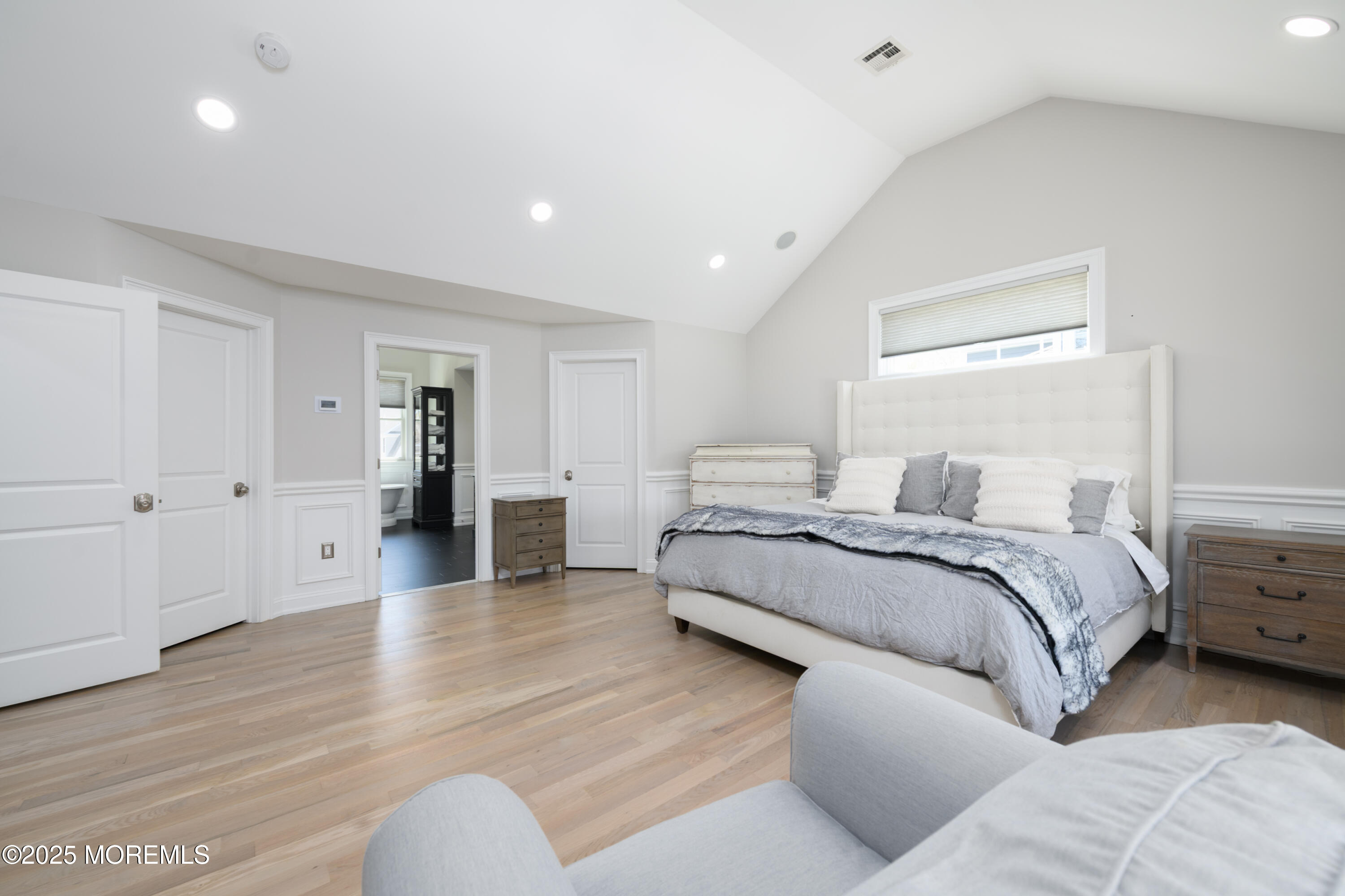 98 Harvard Road Fair Haven, NJ 07704 - Photo 25 of 51 a spacious bedroom with a bed and a couch