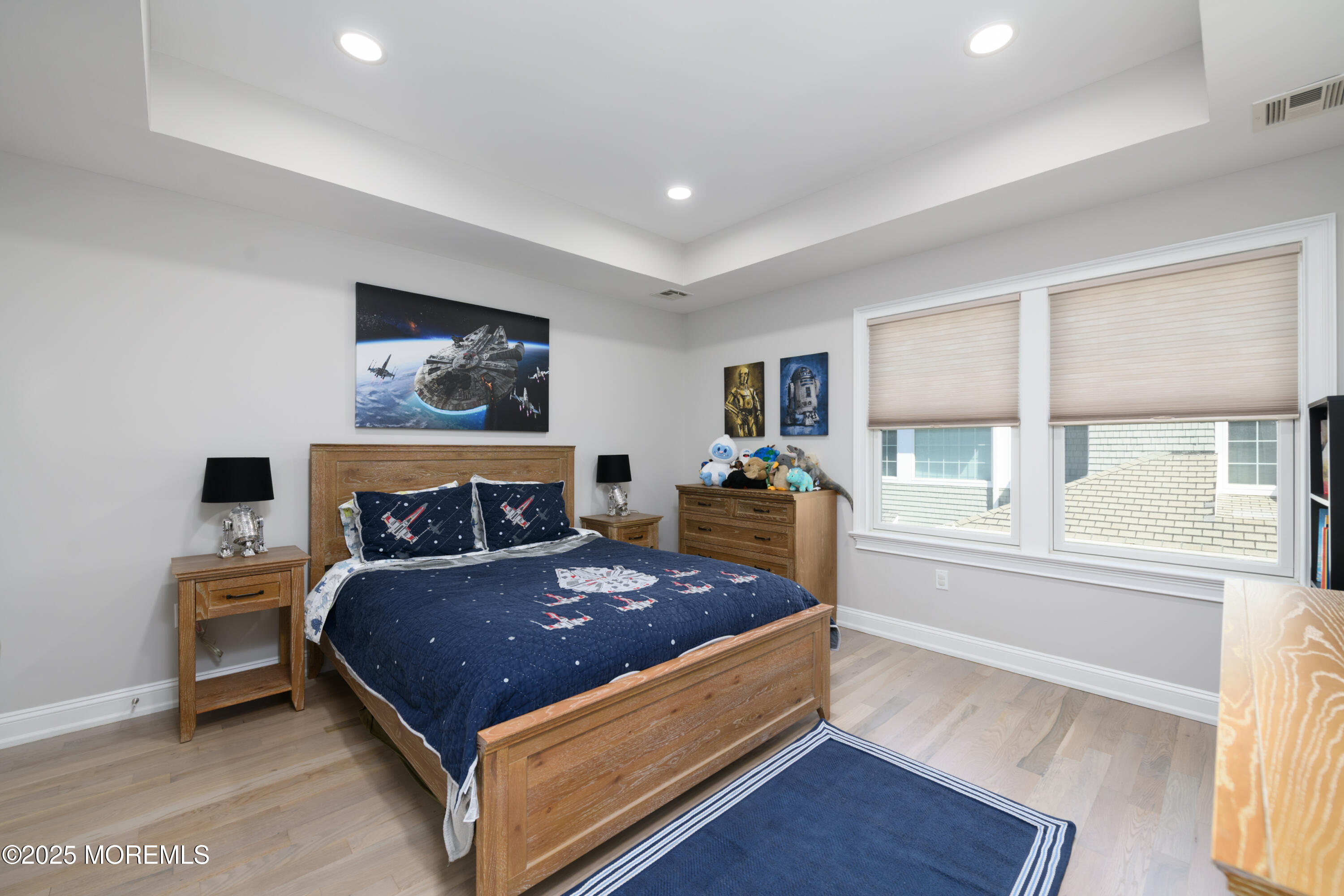 98 Harvard Road Fair Haven, NJ 07704 - Photo 26 of 51 a large bedroom with a bed and wooden floor