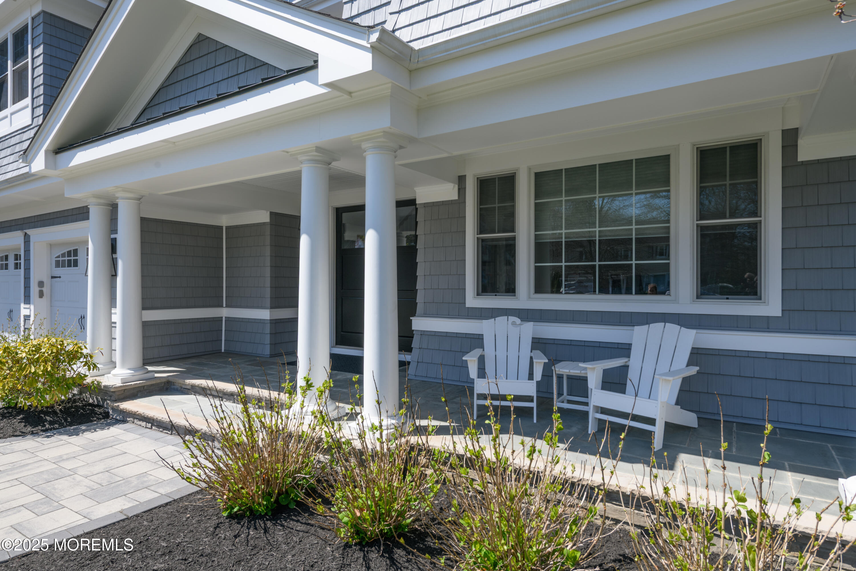 98 Harvard Road Fair Haven, NJ 07704 - Photo 3 of 51 front view of a house with a large window and potted plants