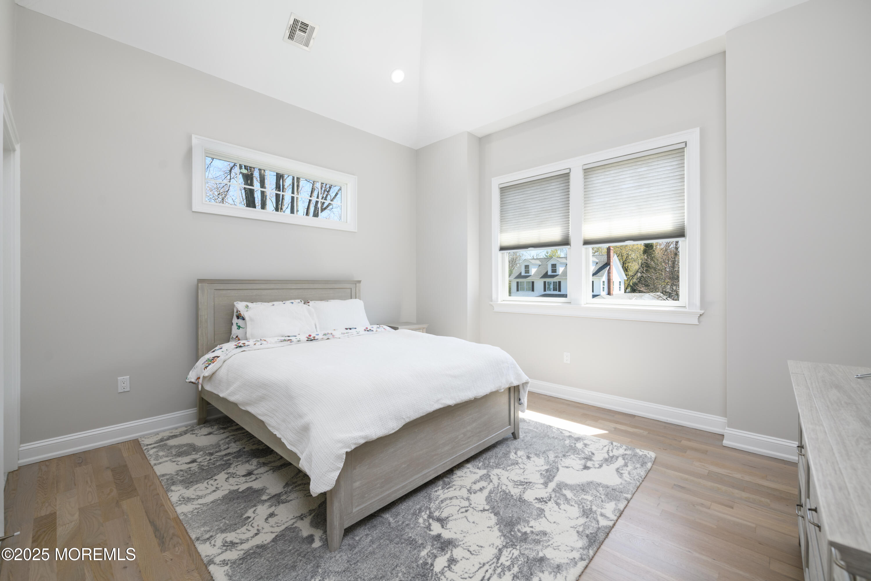 98 Harvard Road Fair Haven, NJ 07704 - Photo 31 of 51 a large bed sitting in a bedroom next to a window