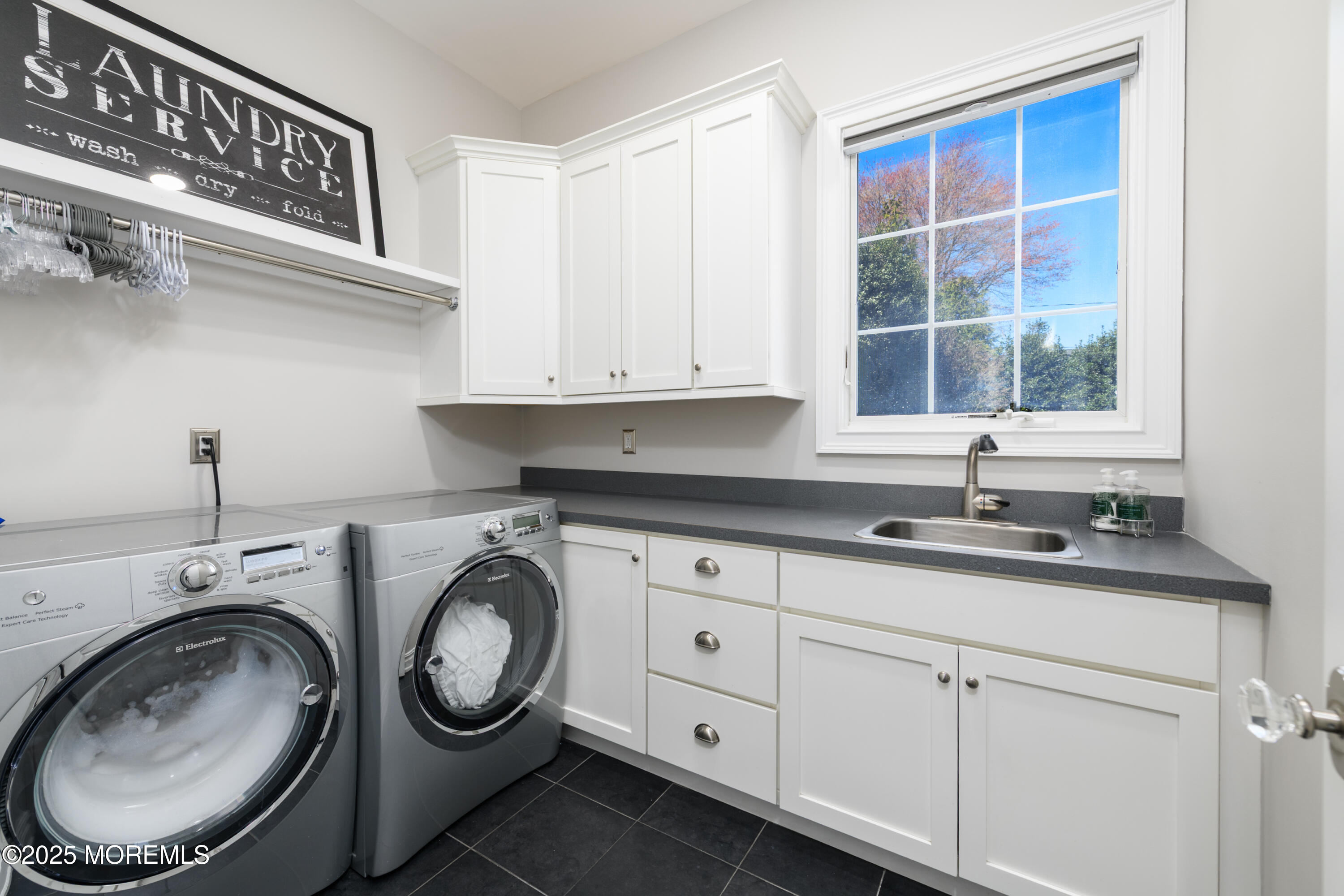 98 Harvard Road Fair Haven, NJ 07704 - Photo 33 of 51 a utility room with sink dryer and washer