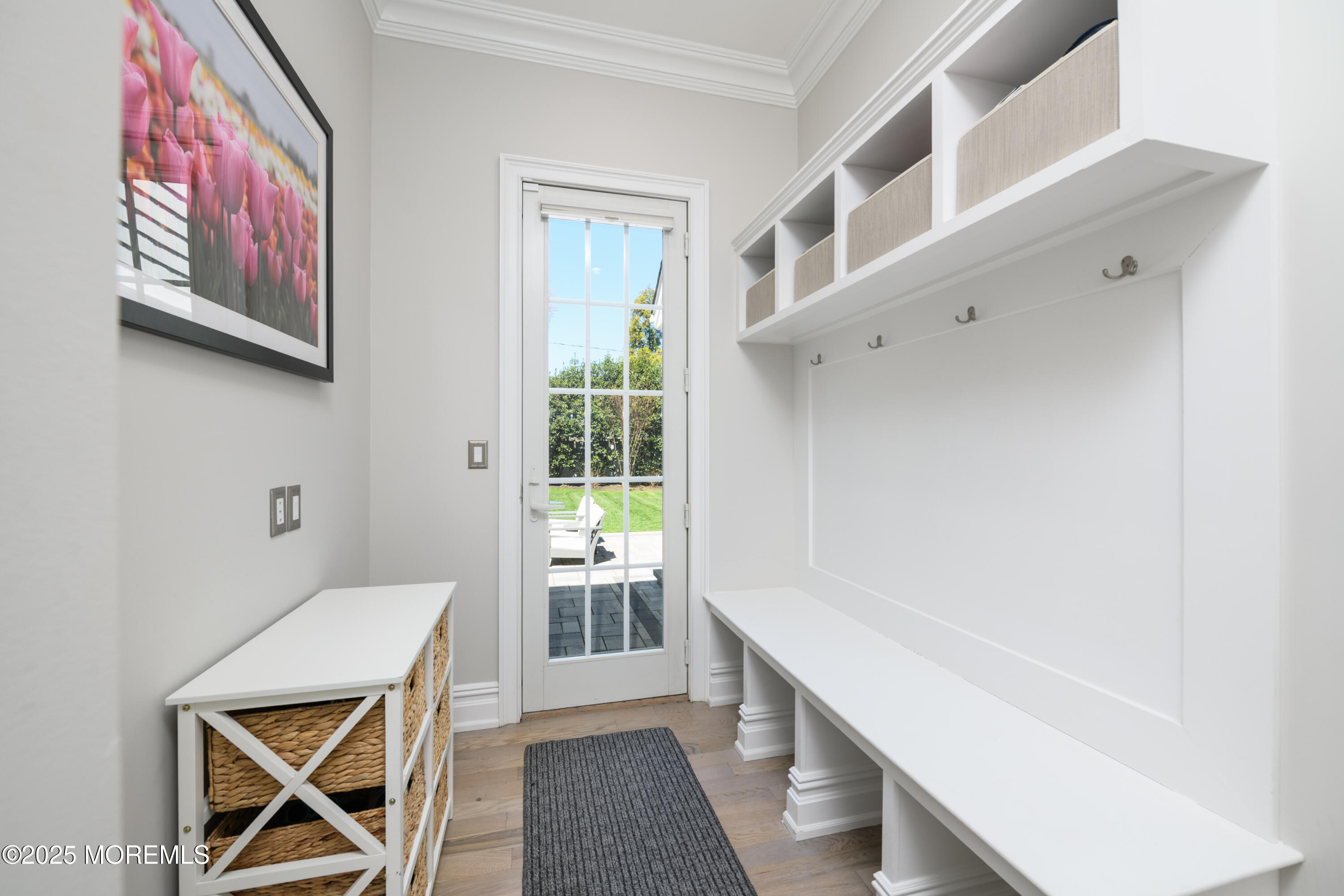 98 Harvard Road Fair Haven, NJ 07704 - Photo 34 of 51 a hallway with a white cabinets and wooden floor