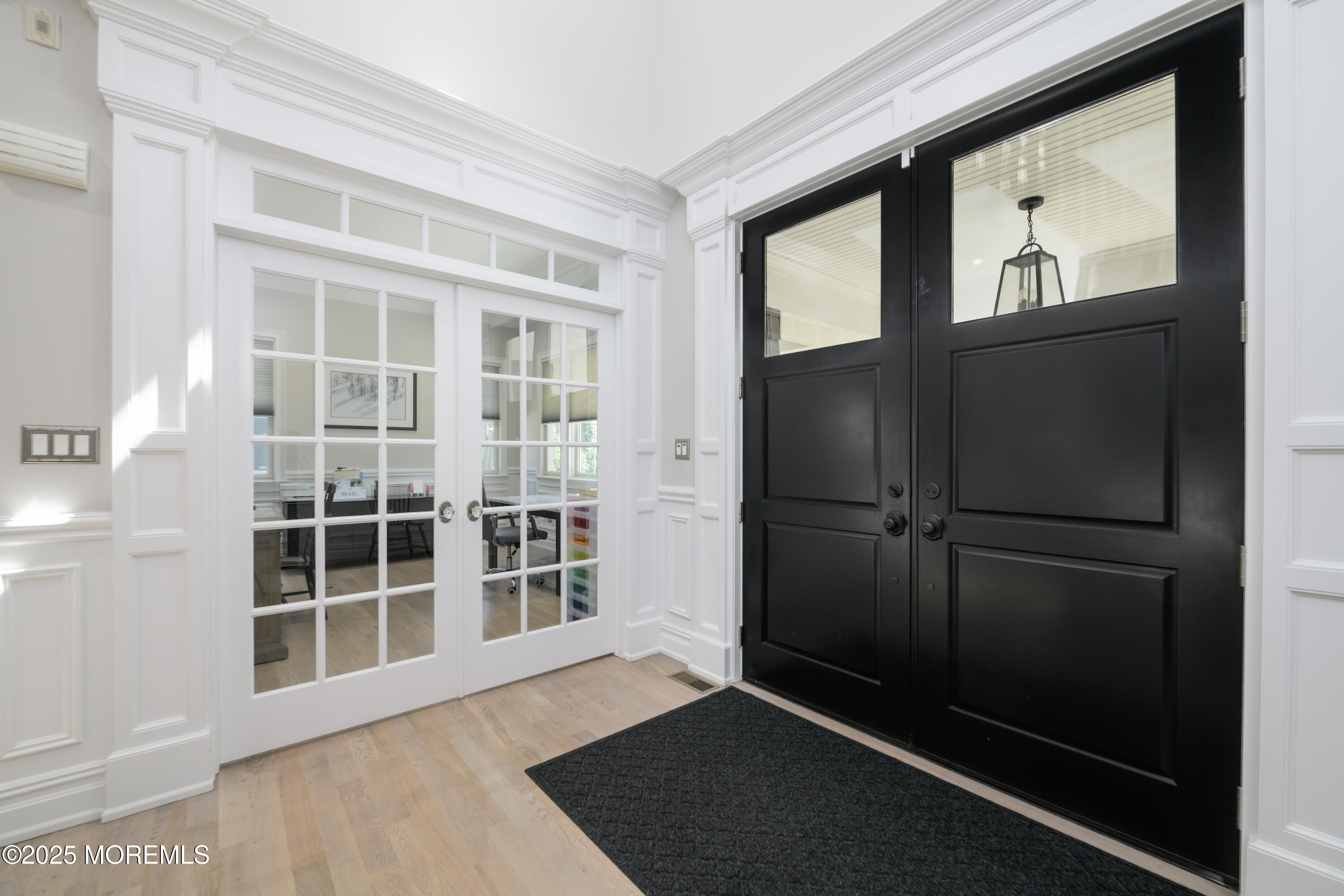 98 Harvard Road Fair Haven, NJ 07704 - Photo 35 of 51 a view of an empty room with wooden floor and windows